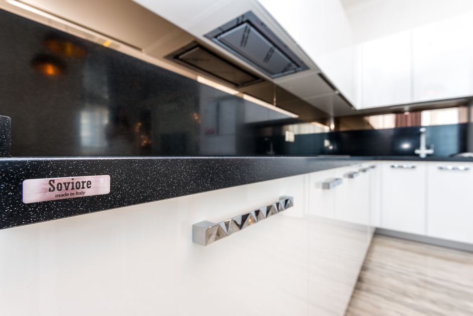Kitchen with white cabinets and a clean countertop.
