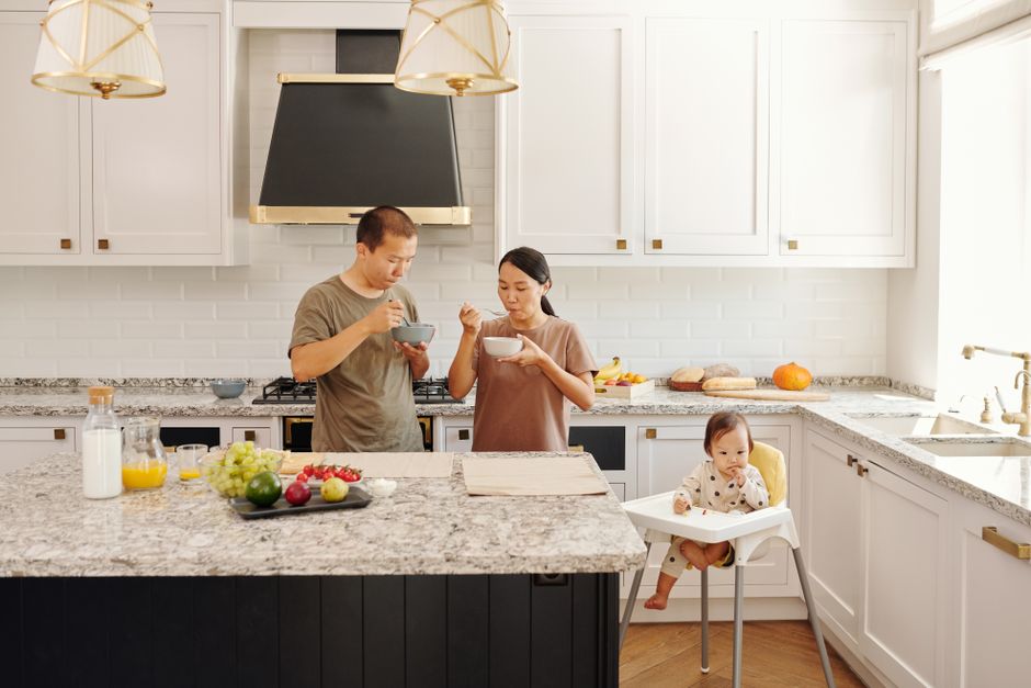 Kitchen with a countertop and a dining table beside it.